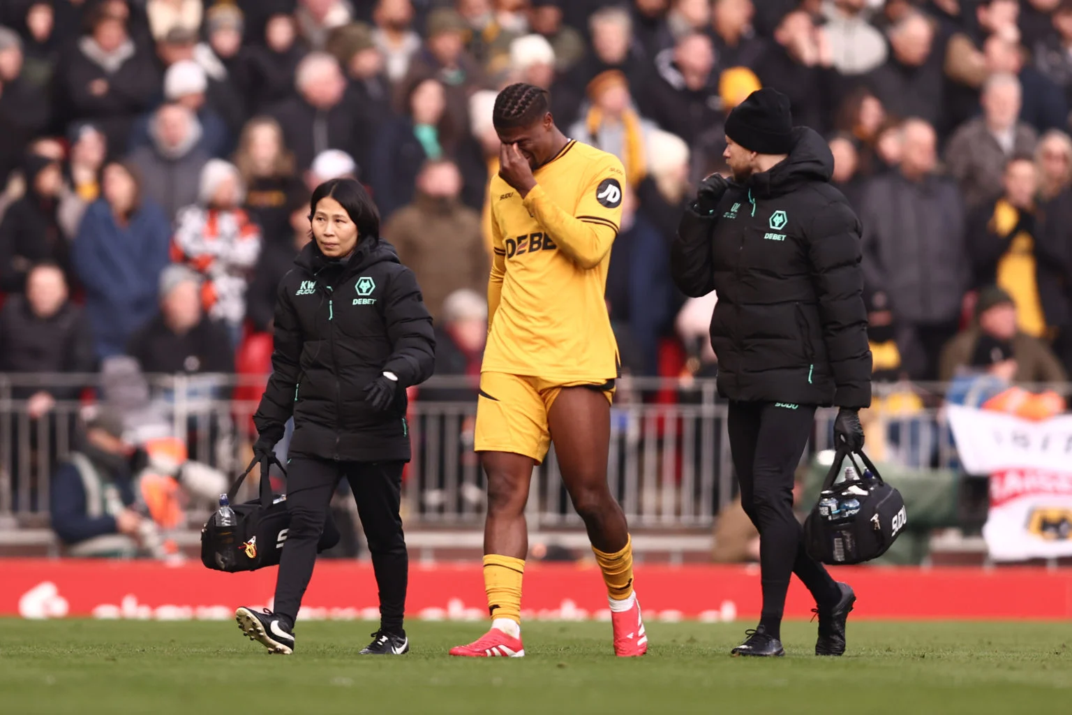 LIVERPOOL FANS FANS BLASTED ONLINE AFTER SINGING CONTROVERSIAL CHANT WHILE EMMANUEL AGBADOU WAS BEING TREATED